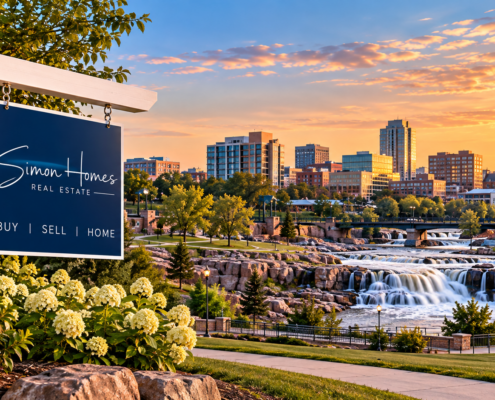 Simon Homes real estate sign overlooking Falls Park and the Sioux Falls, SD skyline.